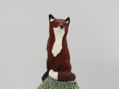 Ceramic trinket holder with a fox on top.