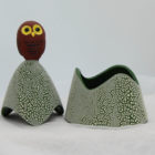 Ceramic trinket holder with a brown on top.