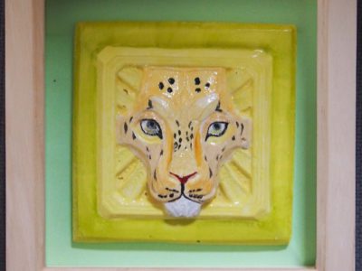 Ceramic tile of a leopard face