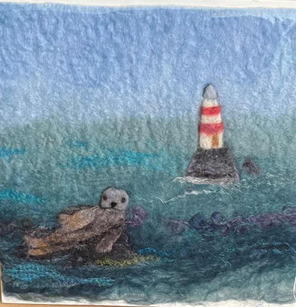 Felted seal picture with lighthouse