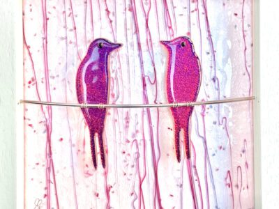 Dichroic Swallows (on wire) x2, in frame with background